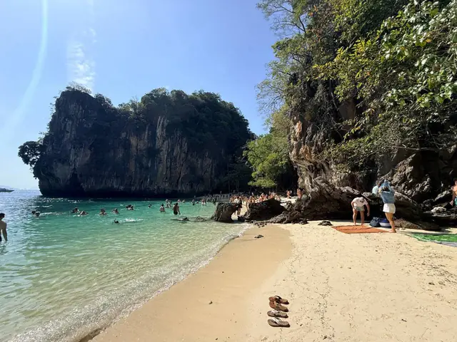Sand and clear shallows beside the cliffs, Hong Islands