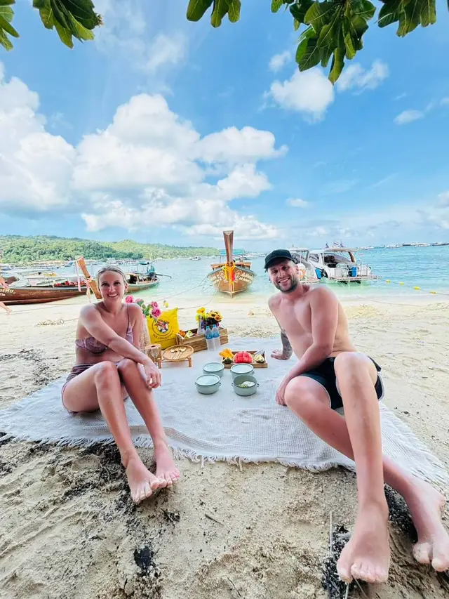 Couple at a beach picnic