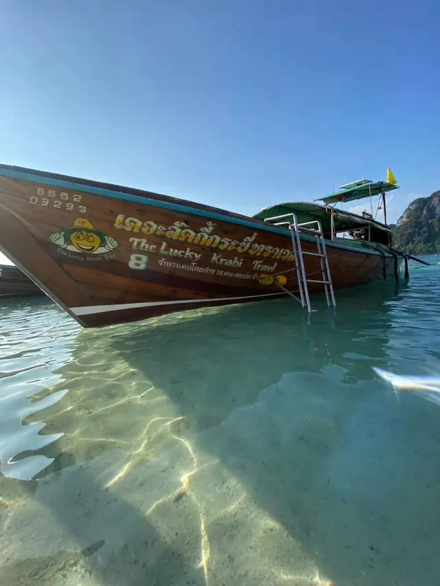 The Lucky Krabi Travel longtail on clear water