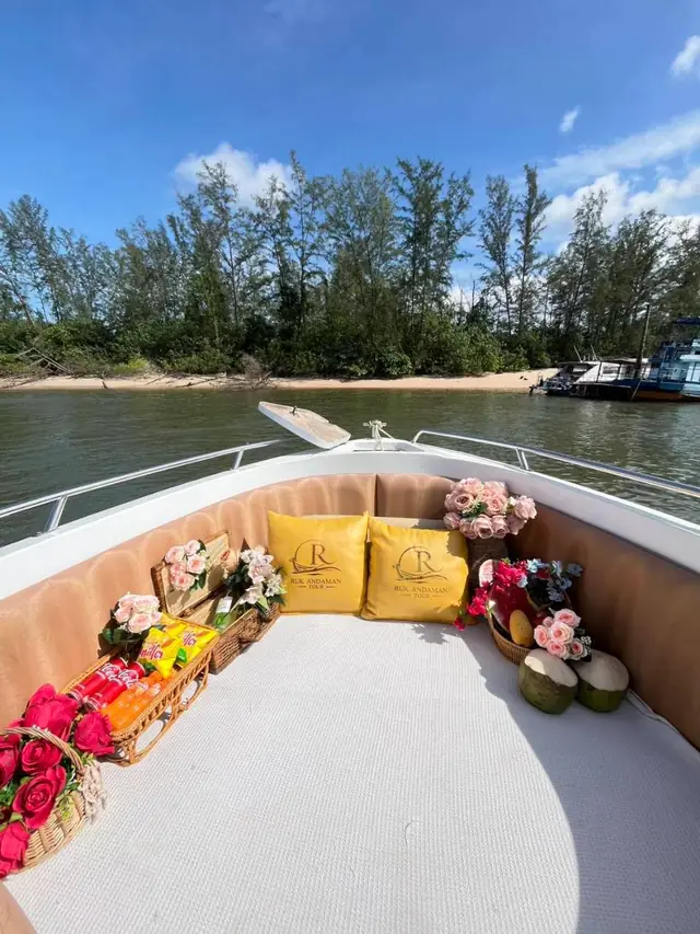 Luxury speedboat bow set with cushions, flowers and fruit