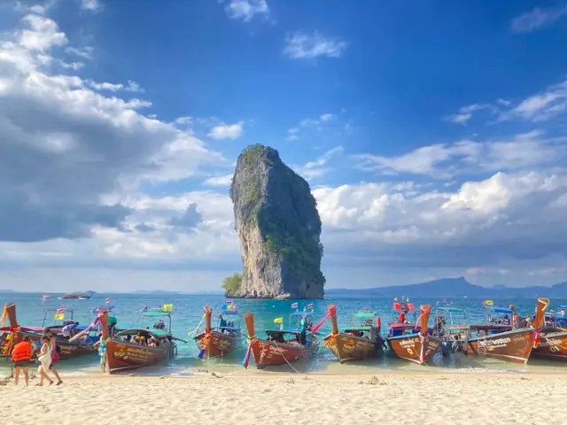 Longtail boats lined up on Poda Island beach
