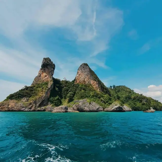 Chicken Island from the boat, clear blue sea