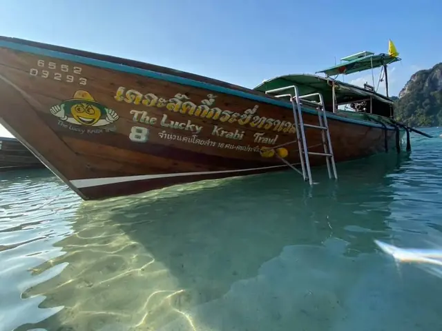 The Lucky Krabi Travel longtail on clear water