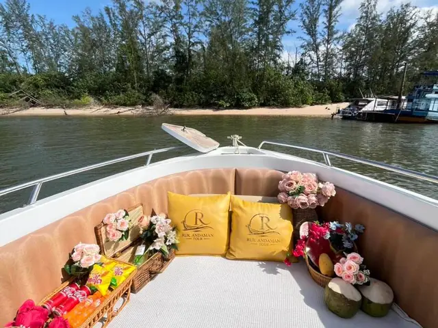 Luxury speedboat bow set with cushions, flowers and fruit
